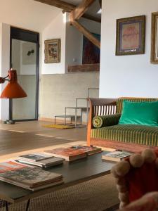 a living room with a couch and a table at 'Le Petit Clos Suites'- Charming Getaway on Leman Lake in Nyon