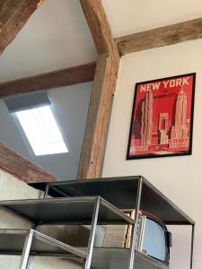 a new york poster on the wall of a building at 'Le Petit Clos Suites'- Charming Getaway on Leman Lake in Nyon