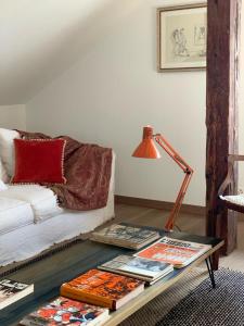a living room with a couch and a table at 'Le Petit Clos Suites'- Charming Getaway on Leman Lake in Nyon