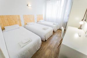 Postel nebo postele na pokoji v ubytování Hotel Joly