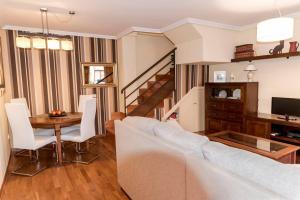 a living room with a couch and a table at La Dama del Jardín del Nuncio in Toledo