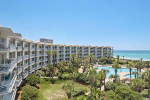 an aerial view of a resort with a pool and the ocean at The Crescent 205 in Destin