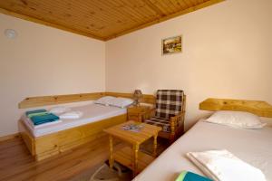 Ένα ή περισσότερα κρεβάτια σε δωμάτιο στο Guest House Edelweiss