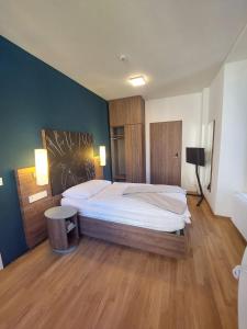 Postelja oz. postelje v sobi nastanitve Hotel Post Glarnerhof