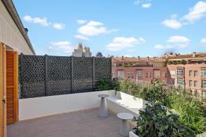 a balcony with a view of the city at B&B HOTEL Apartamentos Madrid Centro Fuencarral 46 in Madrid