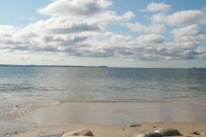 a beach with the ocean and clouds in the sky at Surfside Inn in Hubbards +113 photos