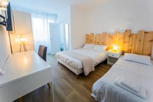 Postel nebo postele na pokoji v ubytování Hotel Joly