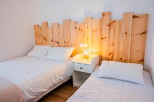 Postel nebo postele na pokoji v ubytování Hotel Joly