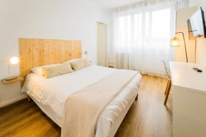 Postel nebo postele na pokoji v ubytování Hotel Joly