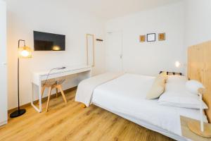 Postel nebo postele na pokoji v ubytování Hotel Joly
