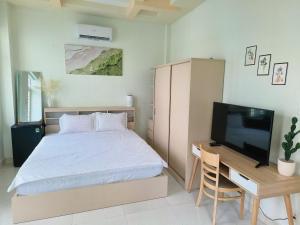 Postel nebo postele na pokoji v ubytování Góc Hải Phòng Drinks & Homestay Q4