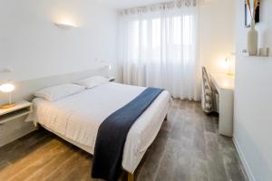 Postel nebo postele na pokoji v ubytování Hotel Joly