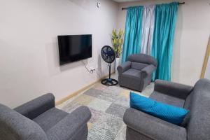 TV a/nebo společenská místnost v ubytování Olivia's Island Serenity Apt1