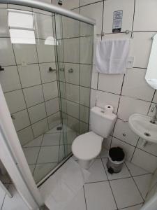 Koupelna v ubytování Hotel Aconchegante + 37 fotografií