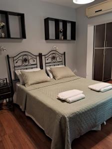 a bedroom with a large bed with two towels on it at CASABLANCA CATAMARCA Guest House in San Fernando del Valle de Catamarca +45 photos