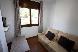 TV a/nebo společenská místnost v ubytování Apart-Hotel Selva Nevada
