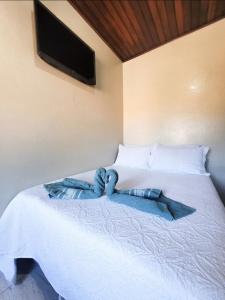 Postel nebo postele na pokoji v ubytování Praia Vermelha Suítes + 11 fotografií