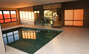 a swimming pool in the middle of a building at Transamerica Executive Sorocaba in Sorocaba