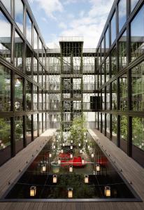a rendering of a building with a garden in the middle at citizenM Southwark Bankside in London +29 photos