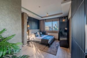 Postel nebo postele na pokoji v ubytování Marlen Hotel Bayraklı