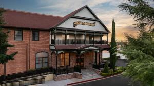a inn with a sign that reads first impressions at Paso Robles Inn in Paso Robles +3 photos