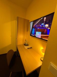 TV i/ili zabavni centar u objektu Hotel Residenz Stockstadt