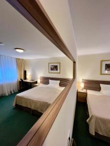 Krevet ili kreveti u jedinici u objektu Hotel Residenz Stockstadt Još 39 fotografija