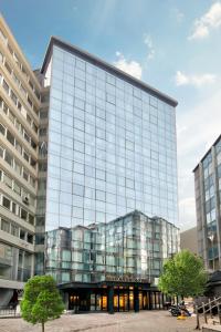 a large glass building with a lot of windows at White Monarch Hotel in Istanbul