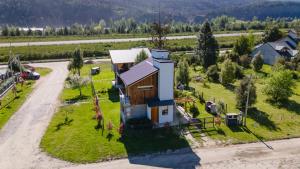 an aerial view of a house on a small island at Origen Rent a house in El Bolsón