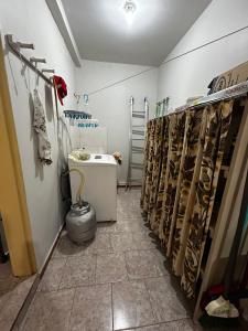 a room with a row of racks of shoes at Casa ampla de 4 quartos in Piratuba +5 photos