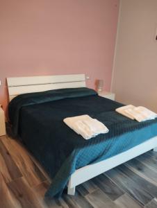 Letto o letti in una camera di Casa vacanze Rosalinda House di fronte al mare di Palermo