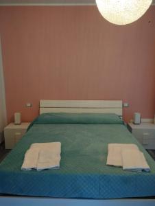 Letto o letti in una camera di Casa vacanze Rosalinda House di fronte al mare di Palermo