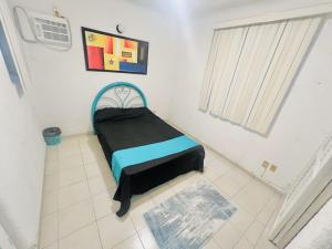 Postel nebo postele na pokoji v ubytování Habitaciones GLV