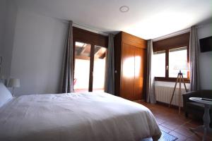 Postel nebo postele na pokoji v ubytování Apart-Hotel Selva Nevada