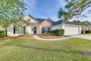 a large house with a driveway at Southern Comfort Oasis in Valdosta