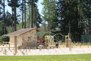 a park with a playground and a play structure at Charmante maison in Cerisi-Belle-Étoile +17 photos