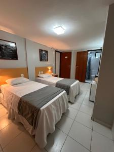 Postel nebo postele na pokoji v ubytování Absolutte Hotel