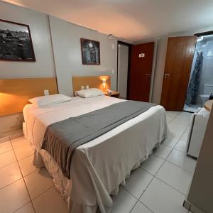 Postel nebo postele na pokoji v ubytování Absolutte Hotel