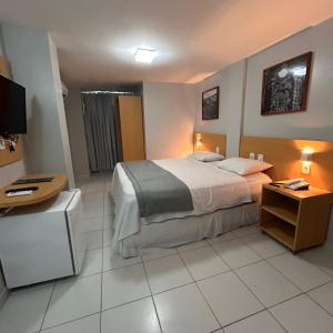 Postel nebo postele na pokoji v ubytování Absolutte Hotel