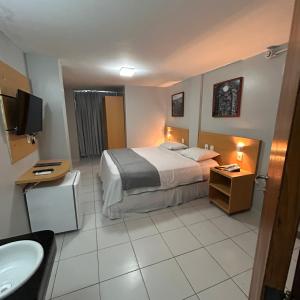 Postel nebo postele na pokoji v ubytování Absolutte Hotel