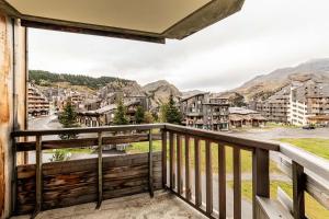 a balcony with a view of a city at L Elinka - Immodreams - Avoriaz in Avoriaz