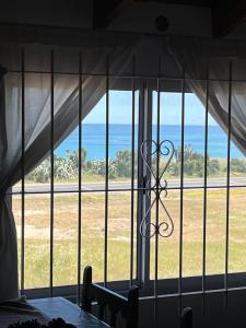 a view of the ocean from a room with a window at Dptos7 Playas del sur in Mar del Plata