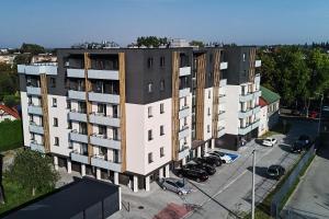 an overhead view of a building with a parking lot at Apartament Wesoła by Stay&Rest - nowoczesność w centrum z balkonem in Czechowice-Dziedzice