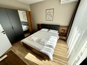 Postel nebo postele na pokoji v ubytování AveNew Luxury Apartment 2