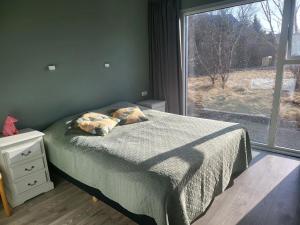Postel nebo postele na pokoji v ubytování Glæsivellir