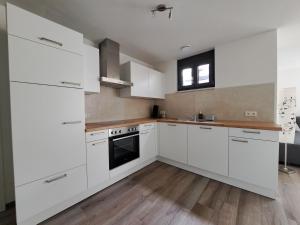 Kuchyň nebo kuchyňský kout v ubytování Ferienwohnung Sonnenseite