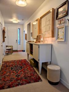 a home office with a desk and a rug at Central location close to Downtown and Mountain Views in South Salt Lake