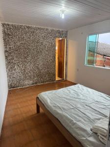 Postel nebo postele na pokoji v ubytování Casa em Angra dos reis