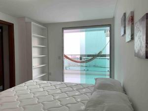 En eller flere senge i et værelse på Casa de Praia 3 Suítes c Ar condicionado e Piscina à 350m da Praia do Morro + 30 billeder