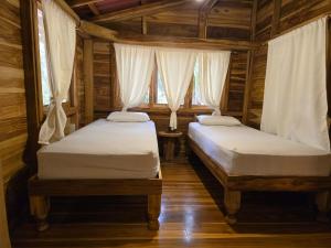 Postel nebo postele na pokoji v ubytování Nueva Tierra